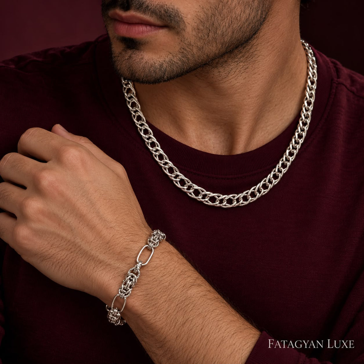 Argent Nexus silver-tone necklace and bracelet set worn by a man