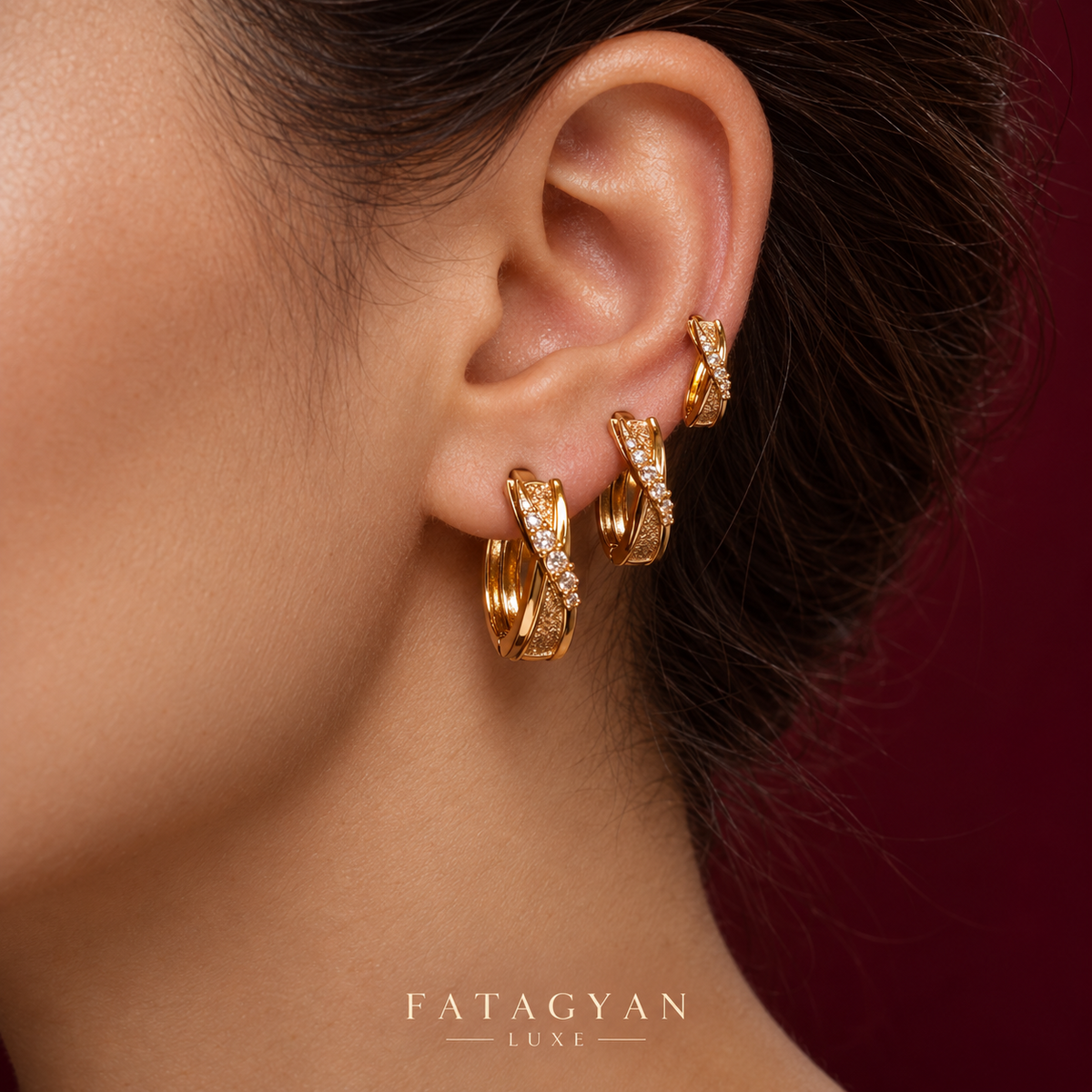 Éclat Crossover Trio Hoop Set worn in three graduated sizes