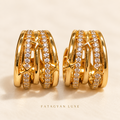 Étoile Orbit Crystal Hoop Earrings in gold tone with pavé crystal bands and star accents