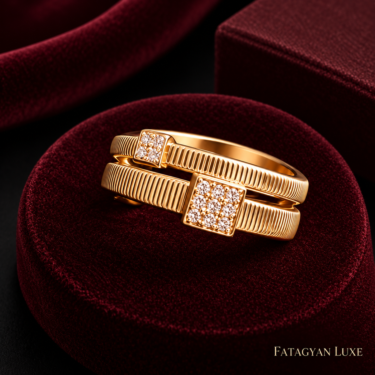 Close-up of Arielle gold-tone double-band square crystal ring on burgundy velvet