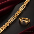 Valeria gold-tone Greek key link bracelet and crystal-accented band ring — hero view