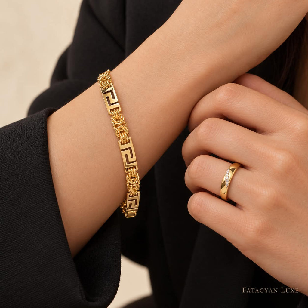 Valeria gold-tone Greek key link bracelet and crystal-accented band ring — worn view