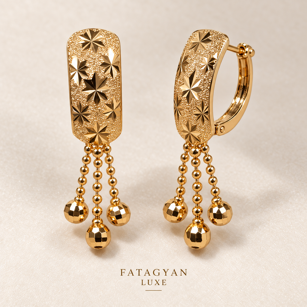 Maison Étoile Tassel Earrings with engraved starburst detailing and gold bead tassels