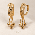 Maison Étoile Tassel Earrings with engraved starburst detailing and gold bead tassels