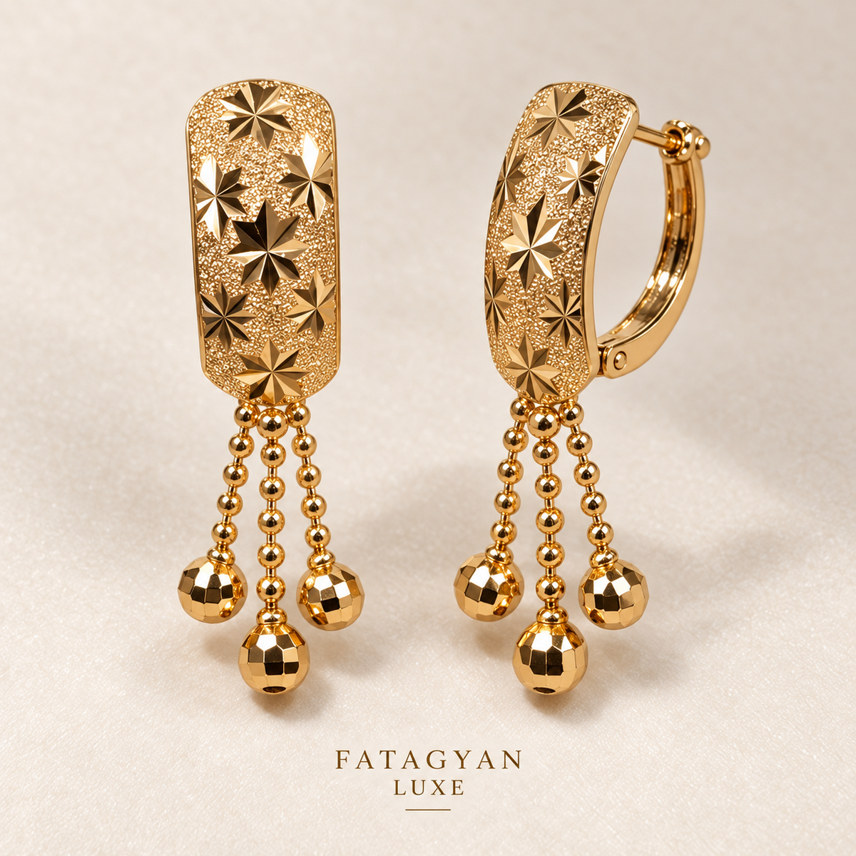 Maison Étoile Tassel Earrings with engraved starburst detailing and gold bead tassels