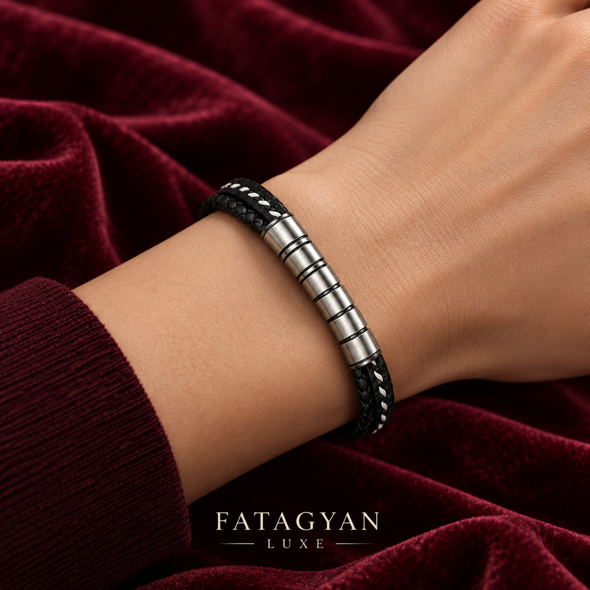 Noir Argent black and silver stainless steel bracelet worn against burgundy velvet