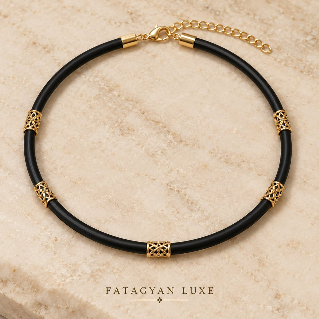 Noir Filigree black cord necklace with 18K gold-plated filigree details on stone