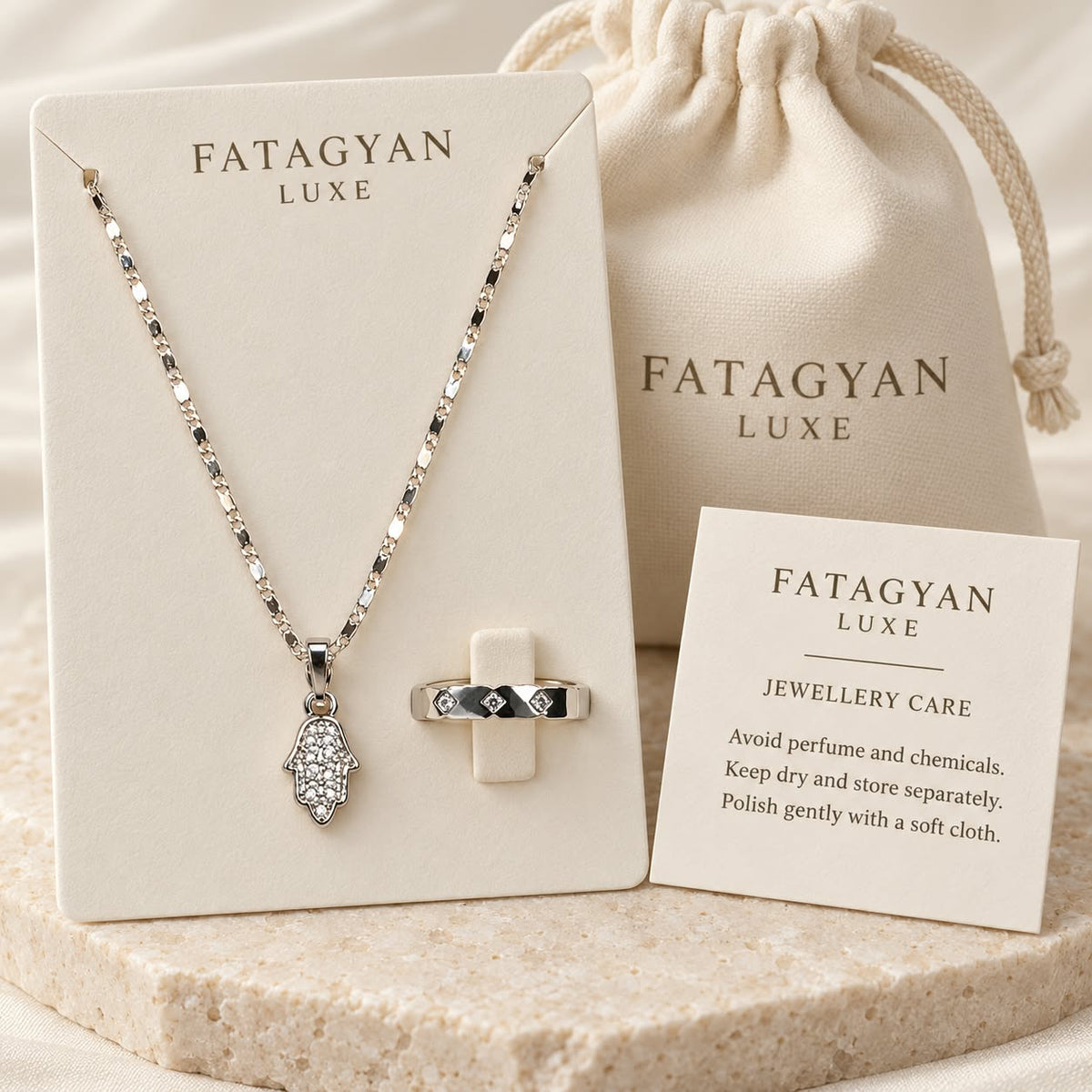 Noura Hamsa crystal necklace and ring set with Fatagyan Luxe packaging