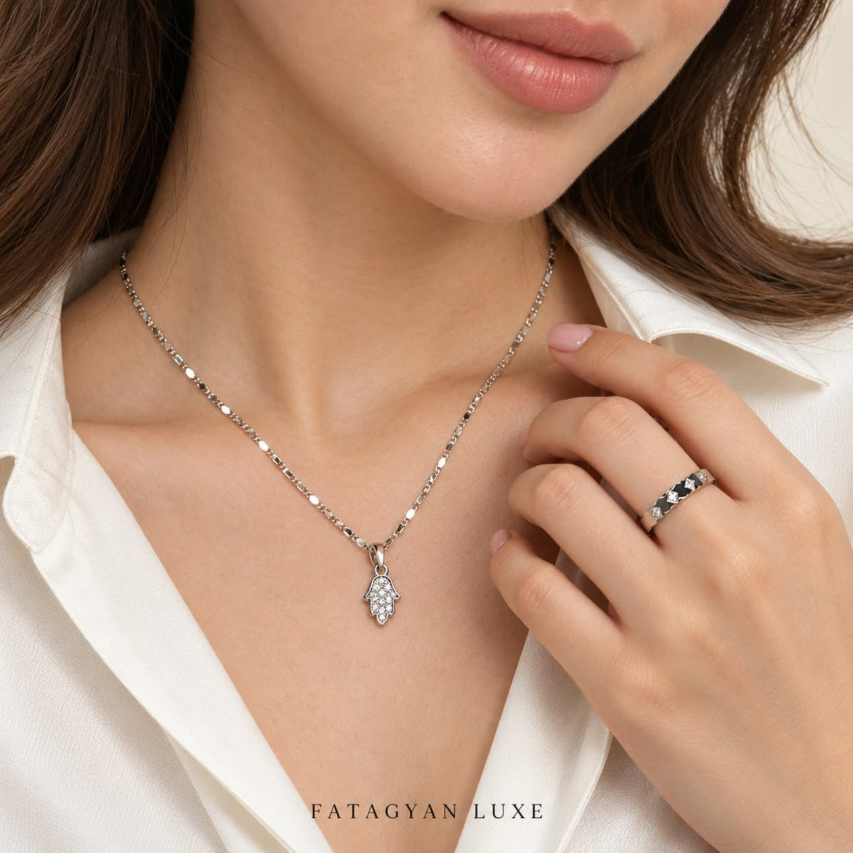 Noura Hamsa crystal necklace and ring set worn