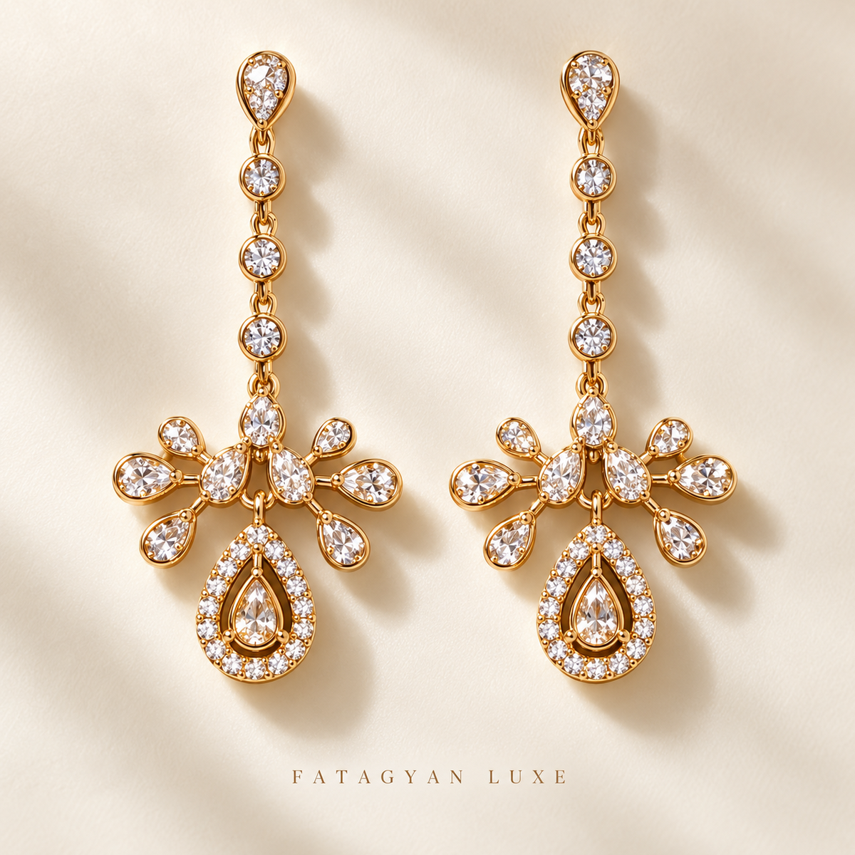 Palais Lumière Chandelier Earrings in gold tone with clear crystal teardrop detailing