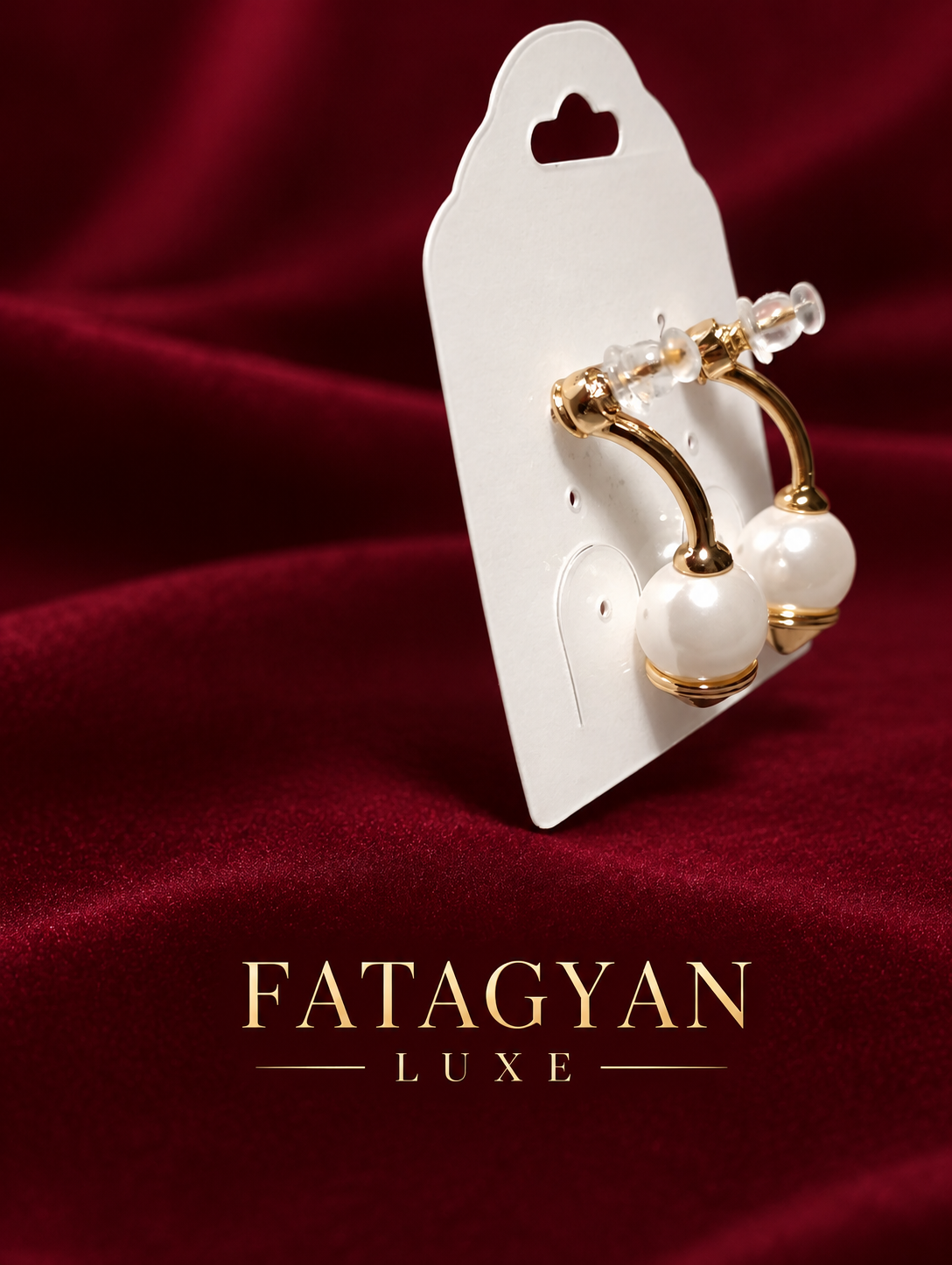 Solène Champagne Pearl Earrings on burgundy Fatagyan Luxe presentation
